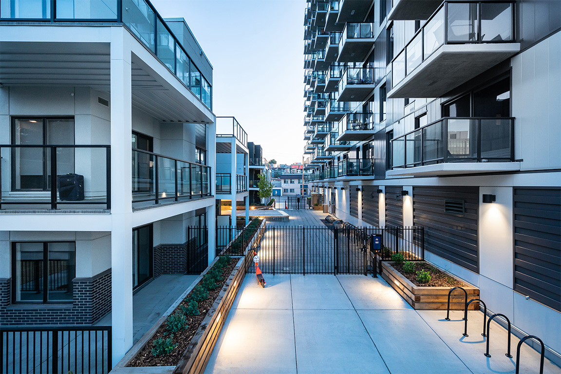 Precision-engineered steel framing components and balconies for a multi-family residential complex